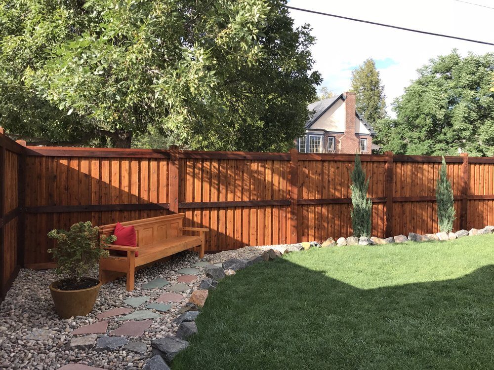 Cedar fence with green lawn